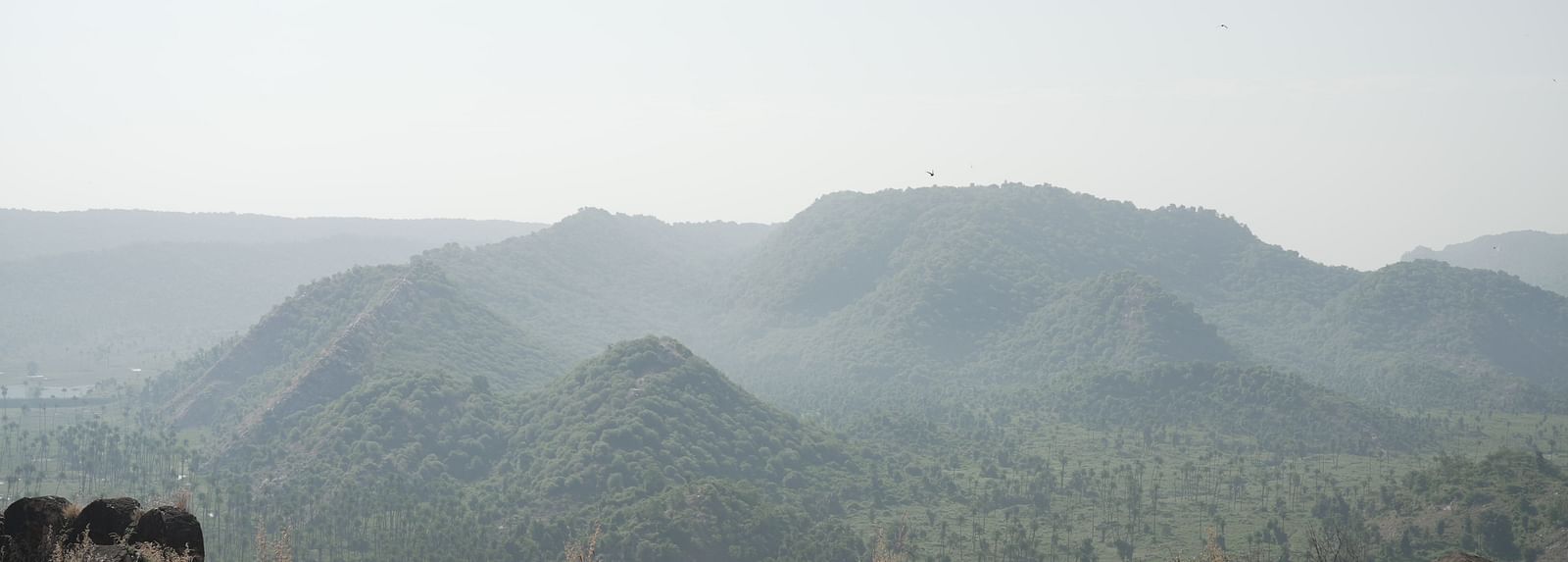 Overview of scenic mountains covered in mist | Utsav Camp